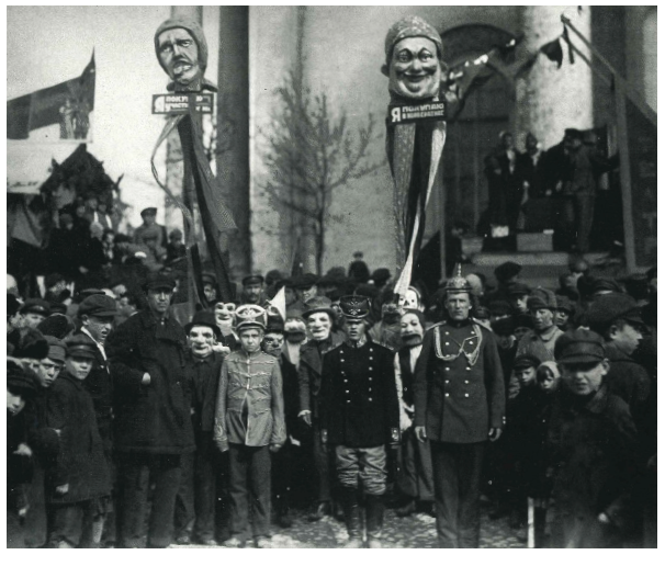 Demonstrācijas dalībnieki ar uz kātiem izstādītām maskām, Ļeņingrada, 1924. gada 1 maijs, Uz kreisaj...