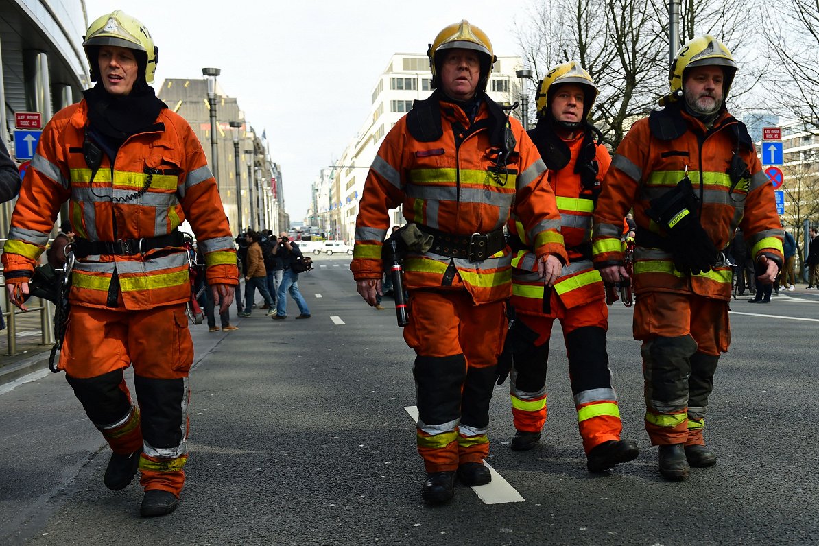 Firefighters arrive at a security perimeter set near Maalbeek metro station,  on March 22, 2016  in...