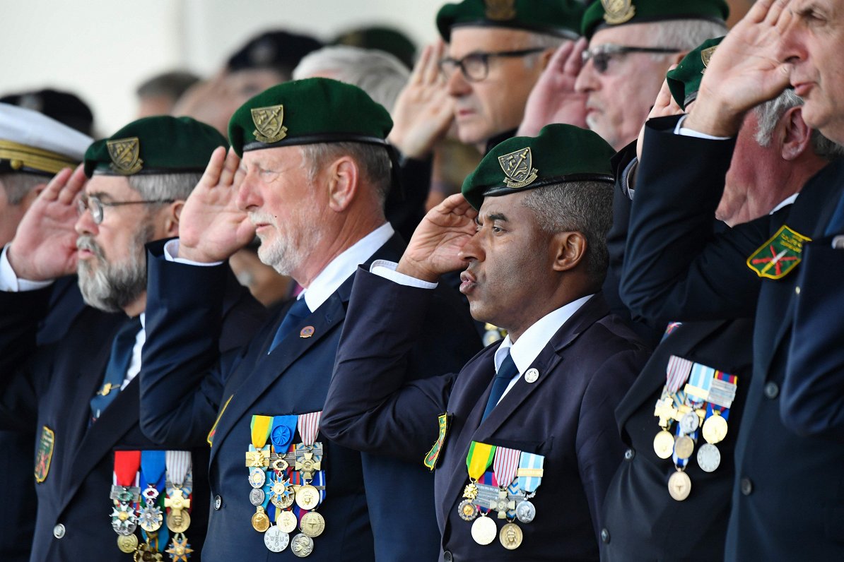 Former French marines salute as they take part in a ceremony in tribute to the 177 French Fusiliers...