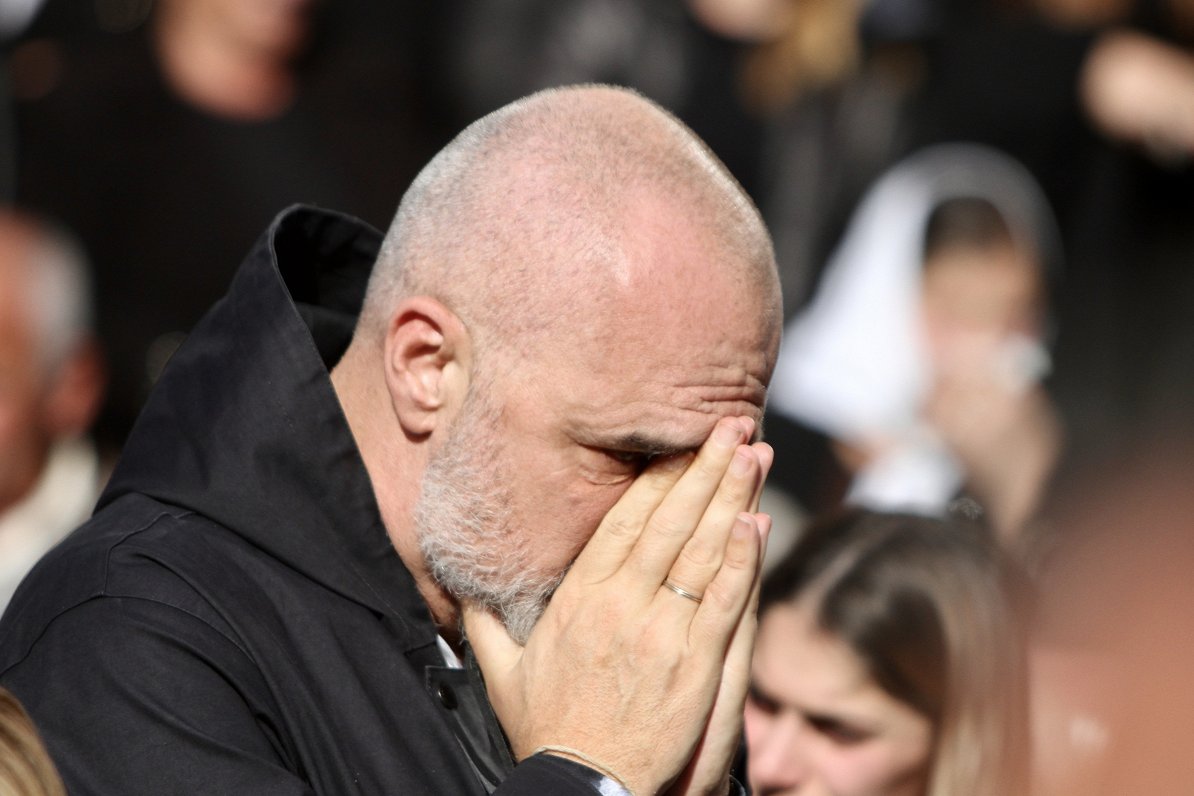 Prime Minister of Albania Edi Rama reacts during the funeral of eight Lala family