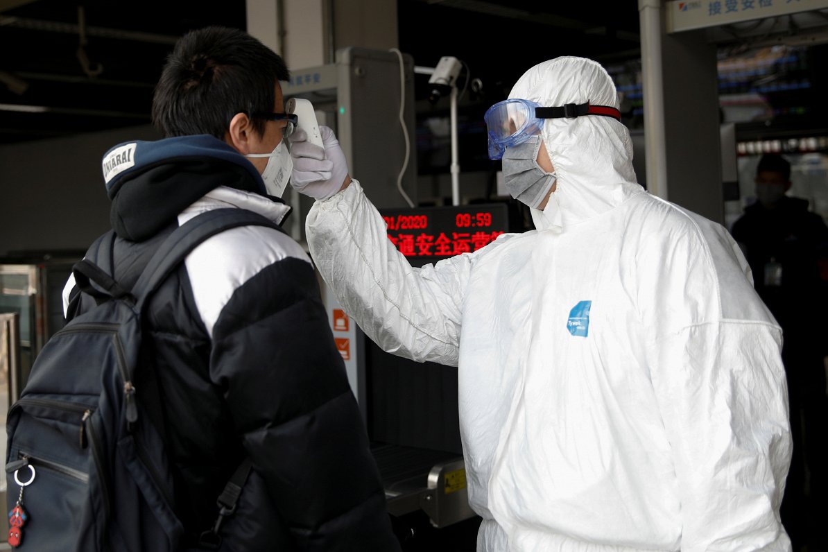 Chinese residents undergo body temperature measurements