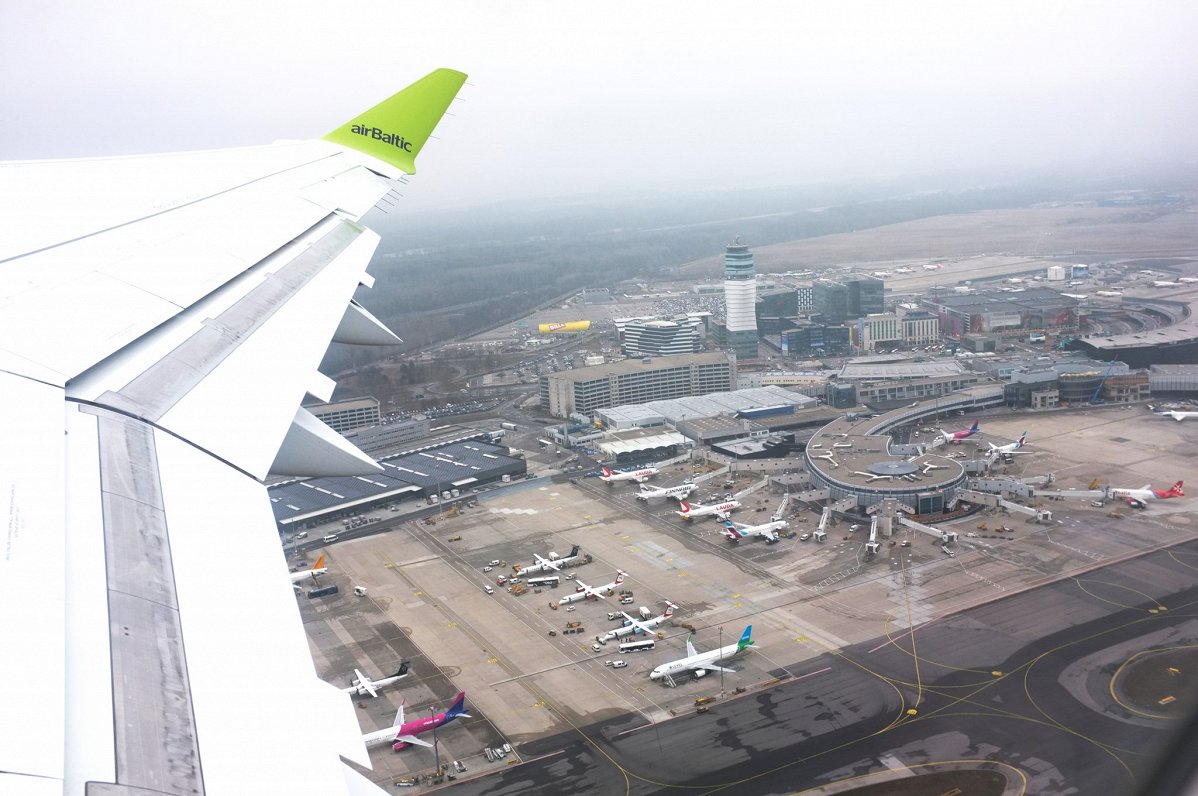 airBaltic airplane flies over Vienna Airport