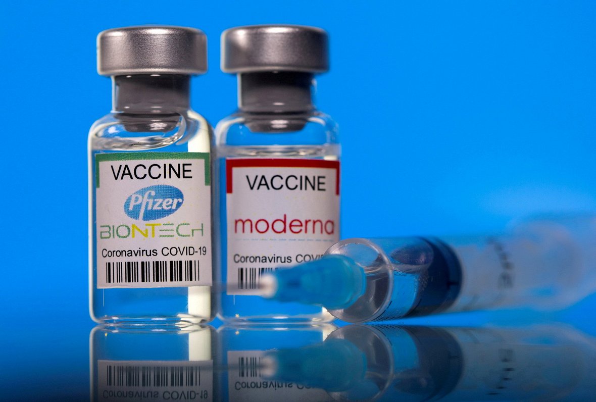 FILE PHOTO: Picture illustration of vials with Pfizer-BioNTech and Moderna coronavirus disease (COVI...