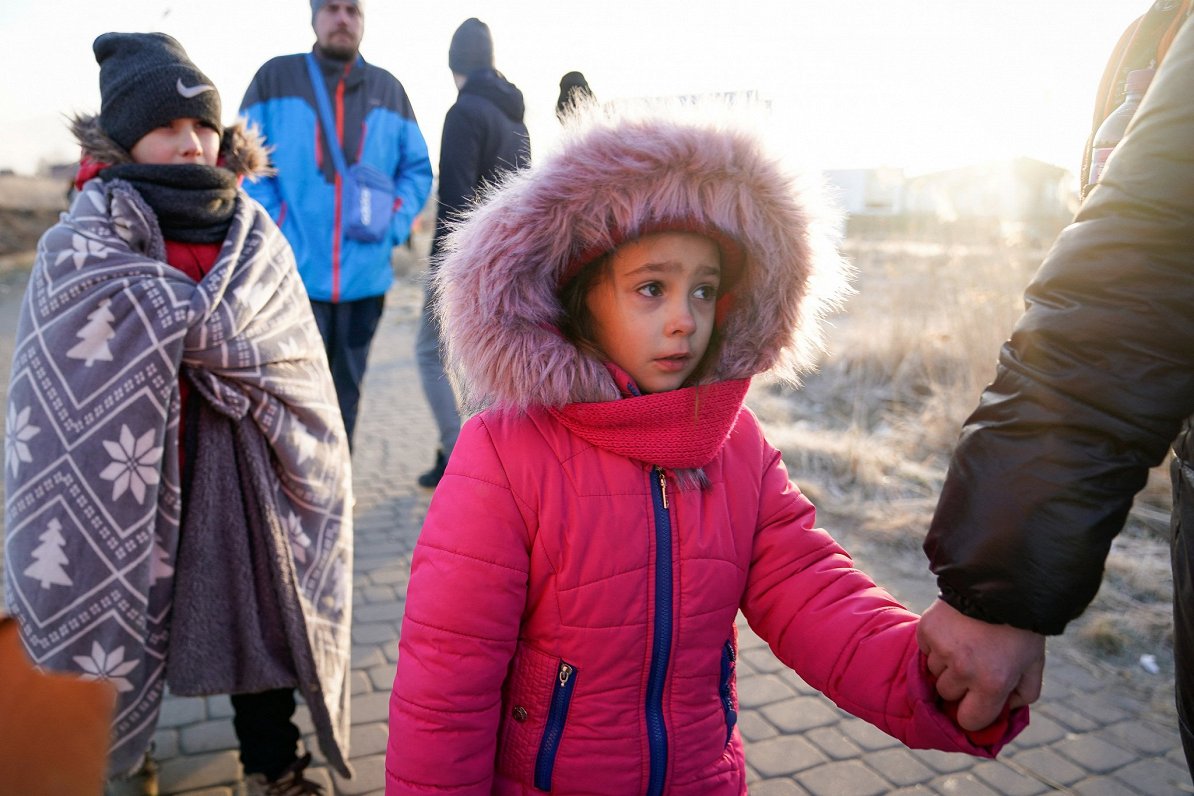 People flee Russian invasion in Ukraine by crossing Polish border