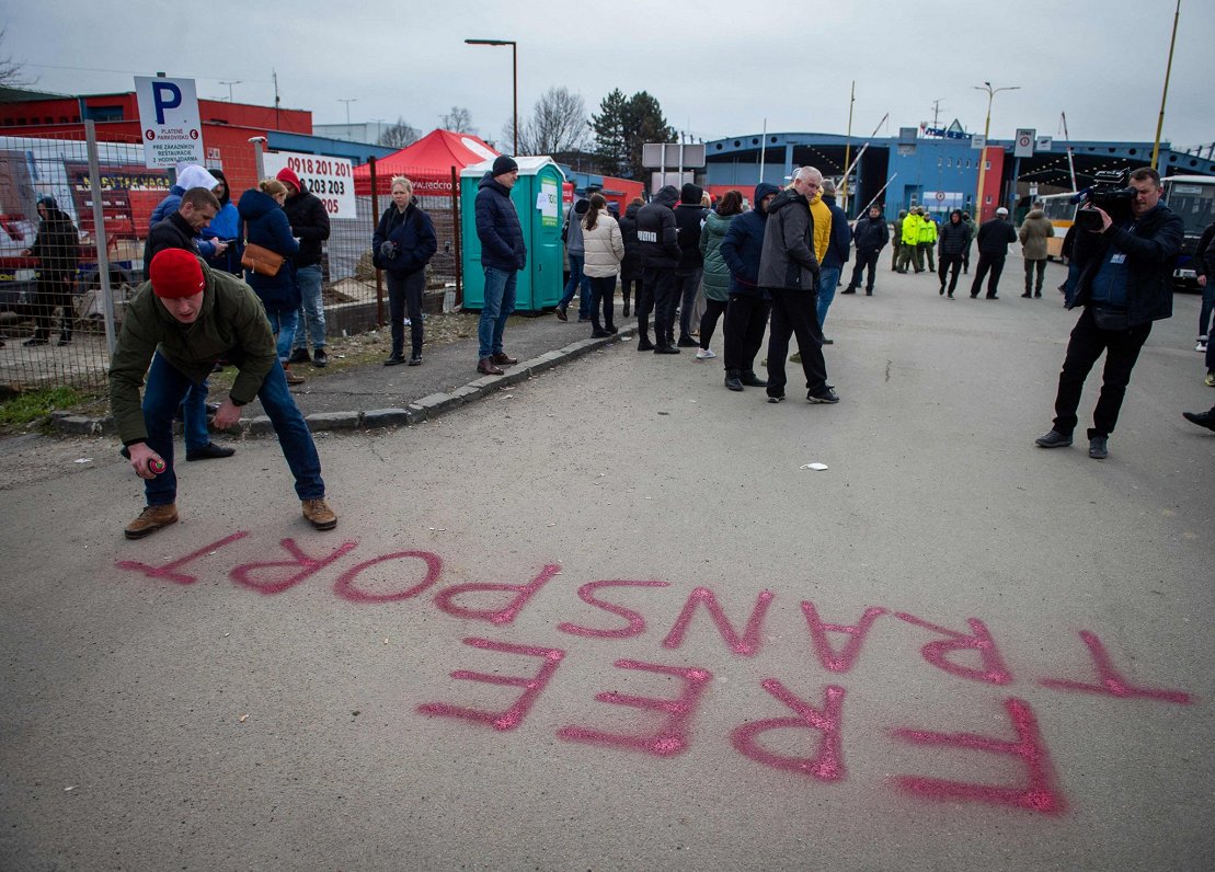 Volunteers offer free transport for Ukrainian refugees at a border crossing in Vysne Nemecke, easter...