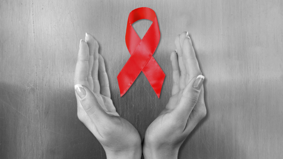Sarkanā lente, kas simbolizē HIV/AIDS