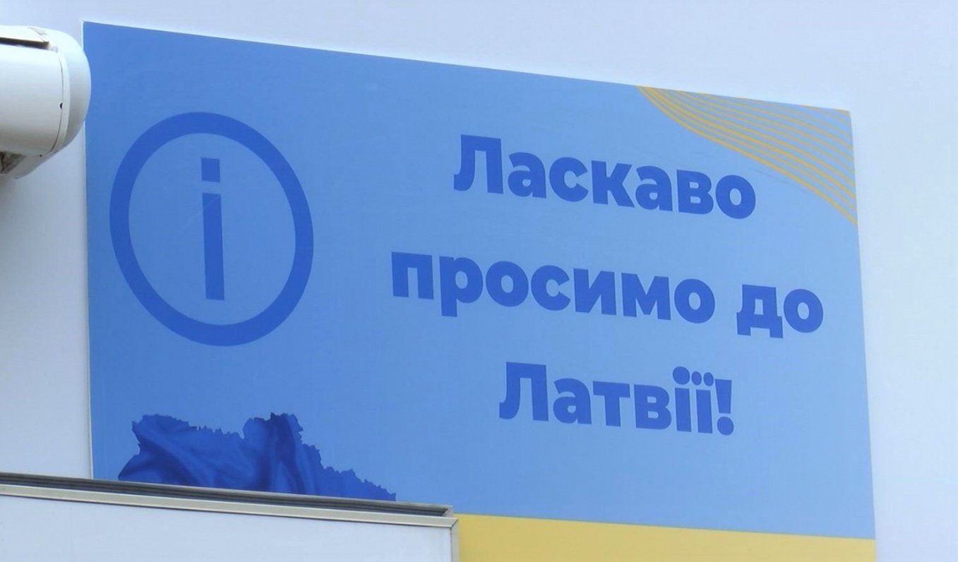 Плакат на латвийской границе. Иллюстрация